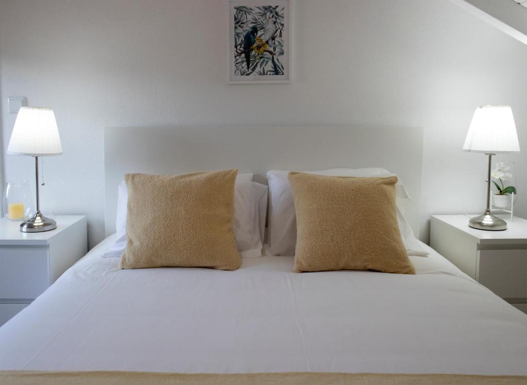 Uma cama ou camas num quarto em Casas Peralta - Marialva