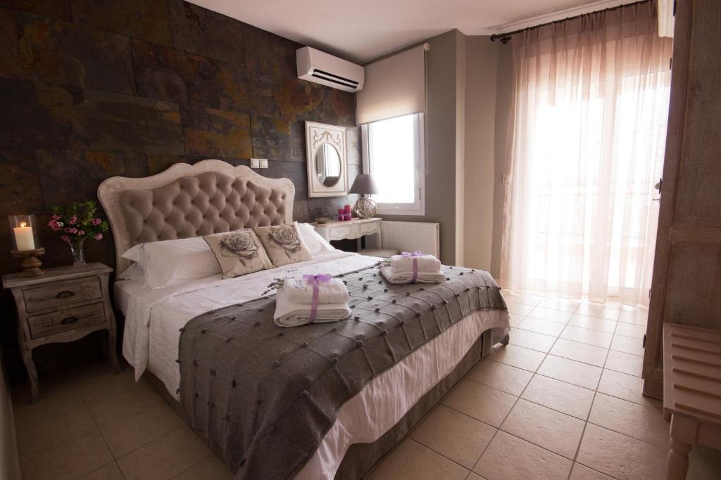 Postel nebo postele na pokoji v ubytování Villa Teresa Luxury Suites
