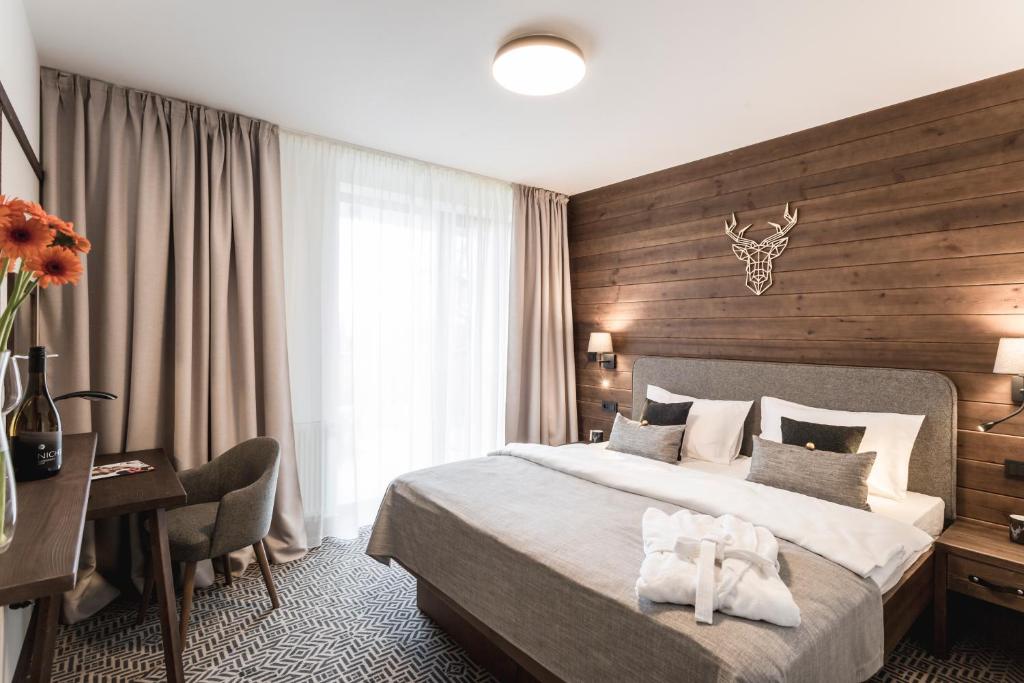 Postel nebo postele na pokoji v ubytování ARIETES MARMONT Resort