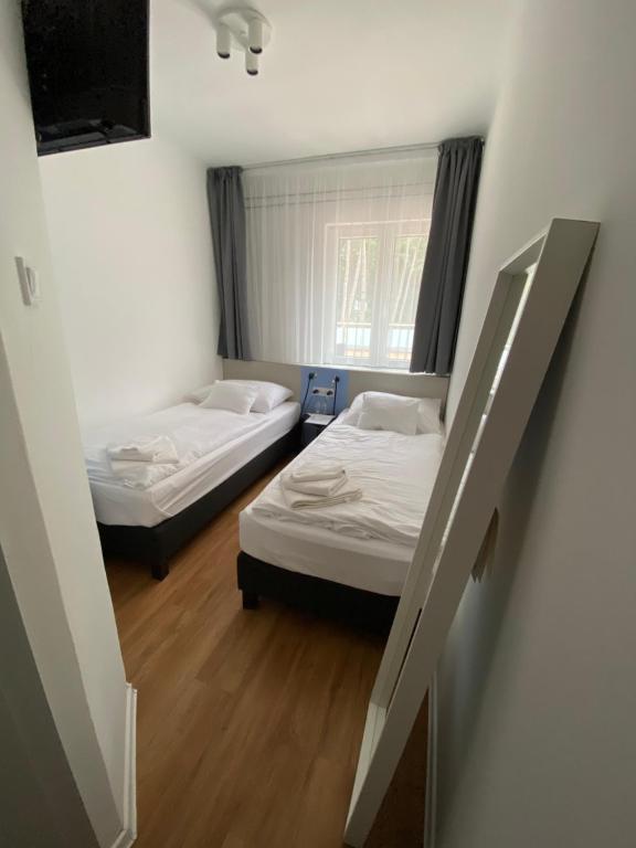 Postel nebo postele na pokoji v ubytování Dalma Panzió