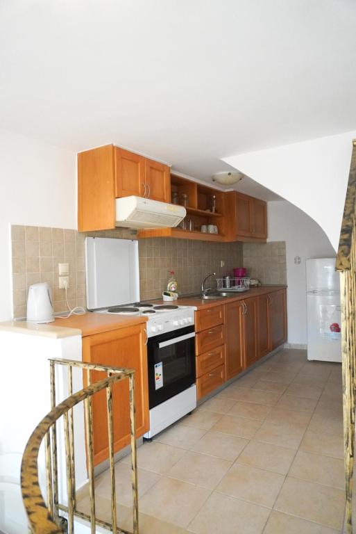 A kitchen or kitchenette at Agapi Holiday Home