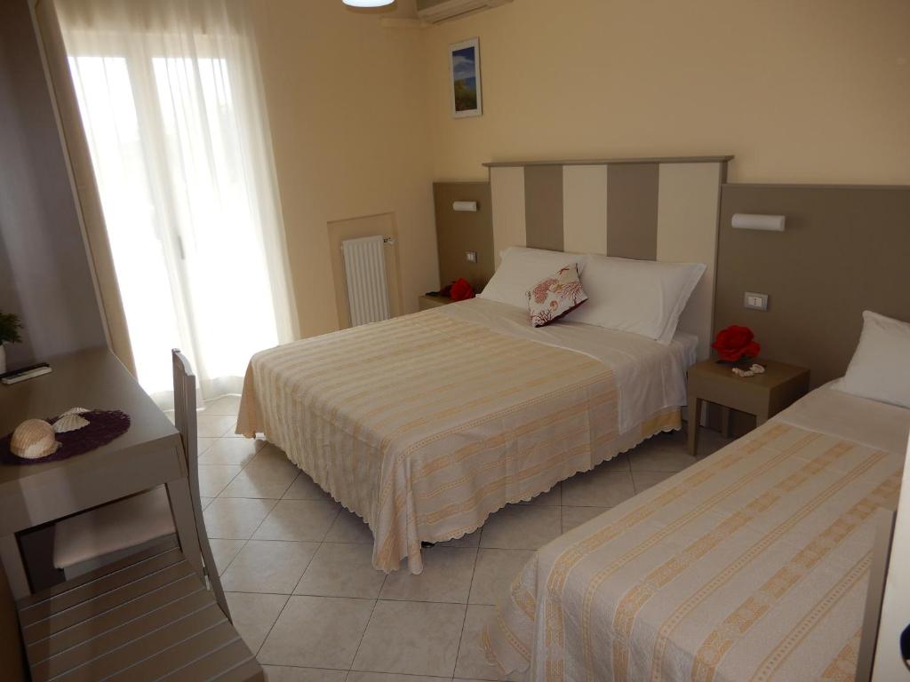 Postel nebo postele na pokoji v ubytování Hotel San Giorgio