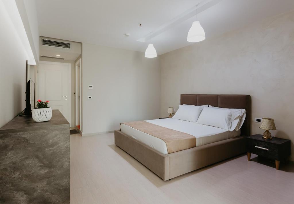Postel nebo postele na pokoji v ubytování Hotel Miki