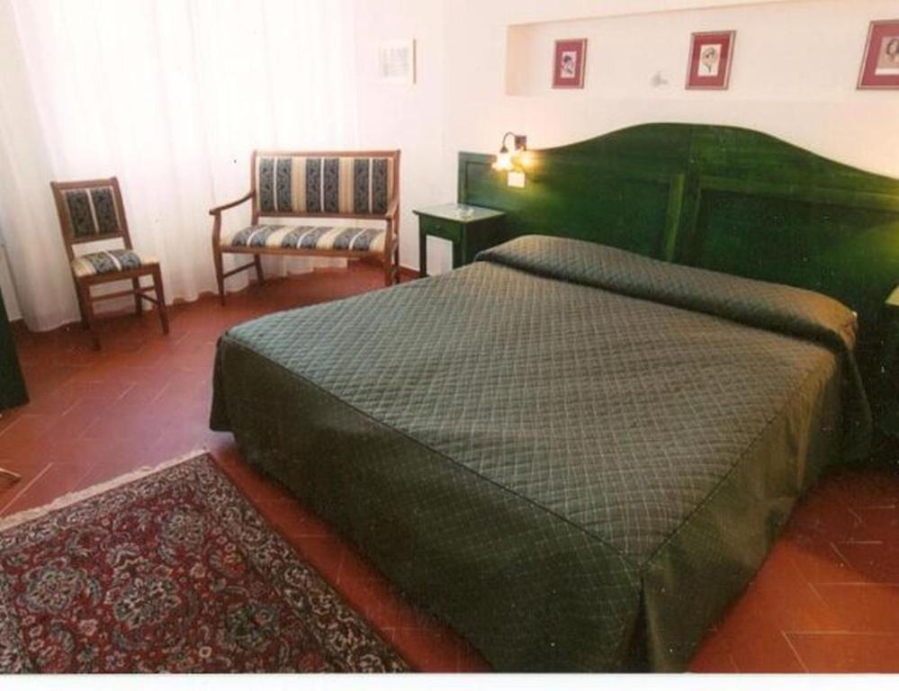 Postel nebo postele na pokoji v ubytování Hotel Monna Lisa
