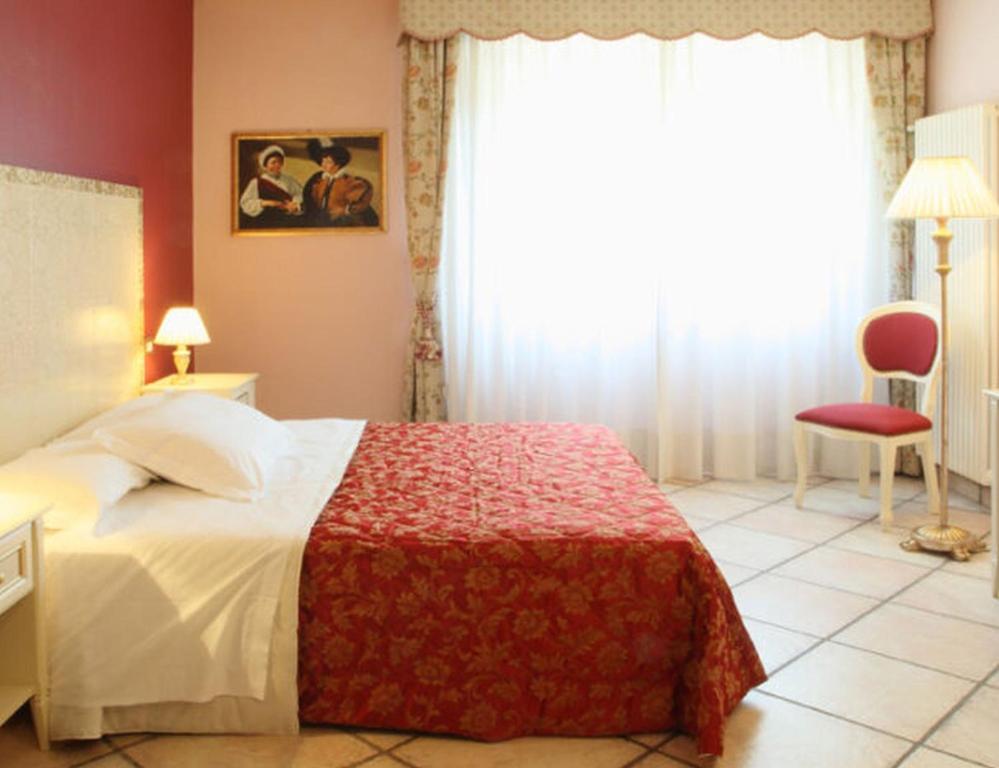 Postel nebo postele na pokoji v ubytování Hotel Monna Lisa