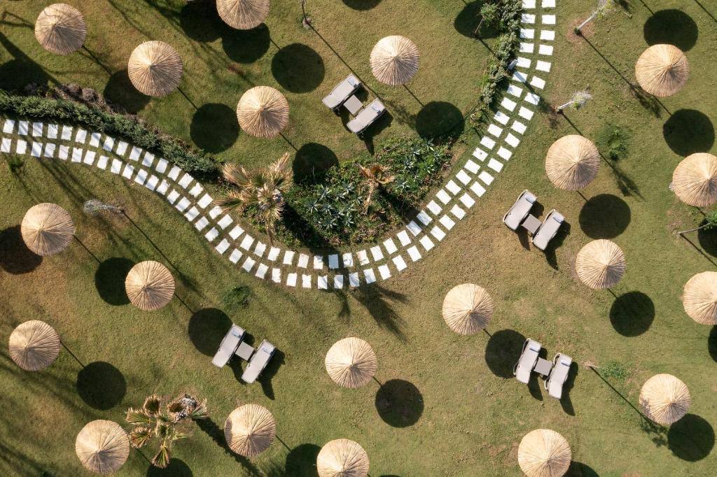 an overhead view of a winding road in a park with trees at Radisson Collection Hotel, Bodrum in Akyarlar