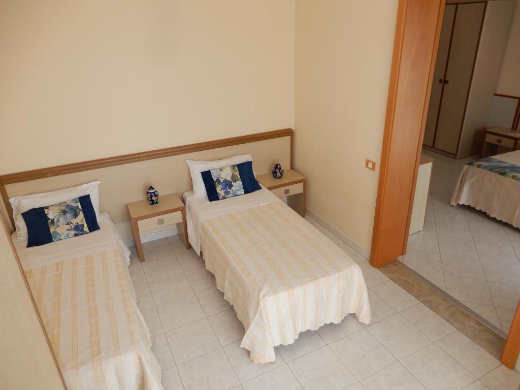Postel nebo postele na pokoji v ubytování Hotel San Giorgio