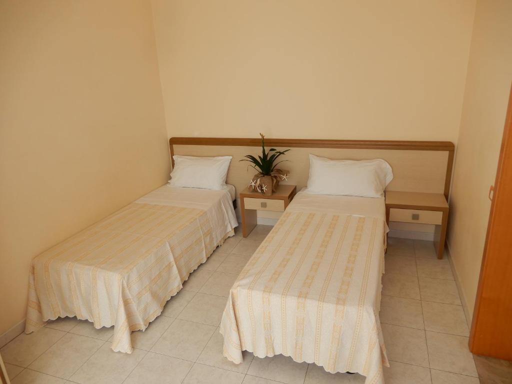 Postel nebo postele na pokoji v ubytování Hotel San Giorgio