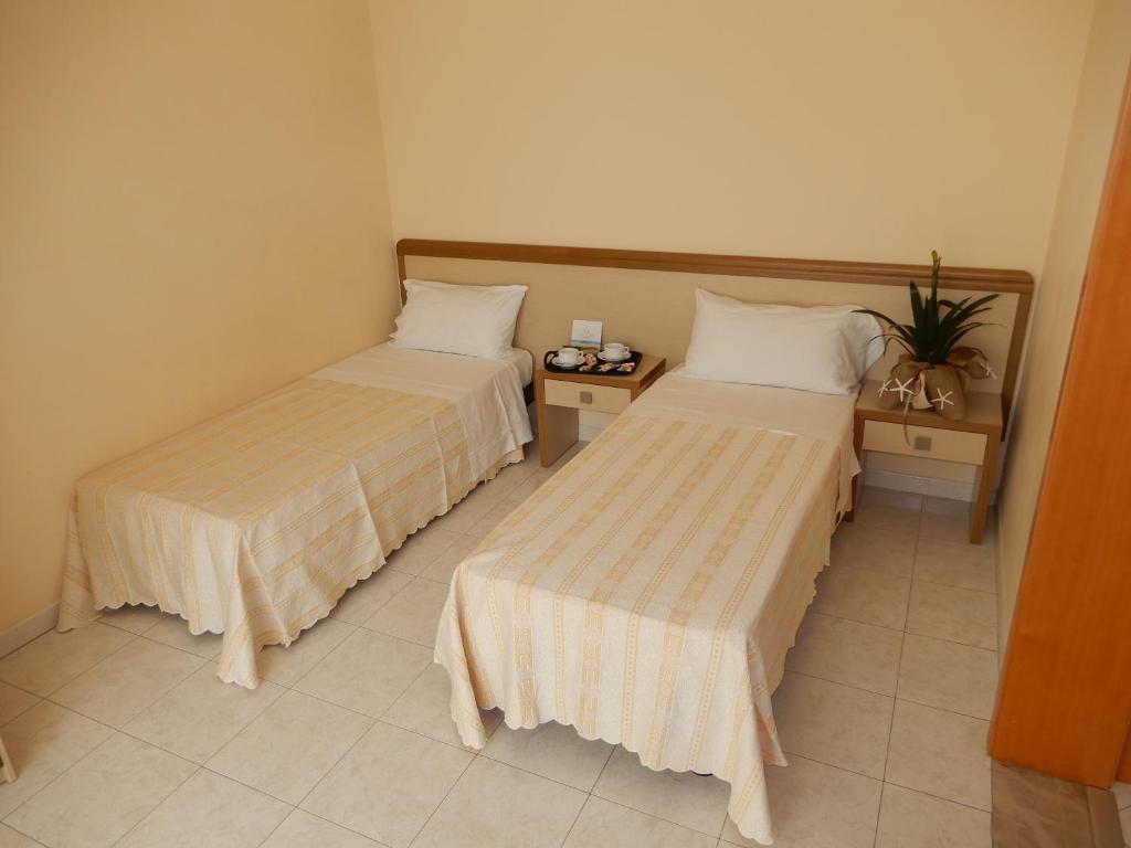 Postel nebo postele na pokoji v ubytování Hotel San Giorgio