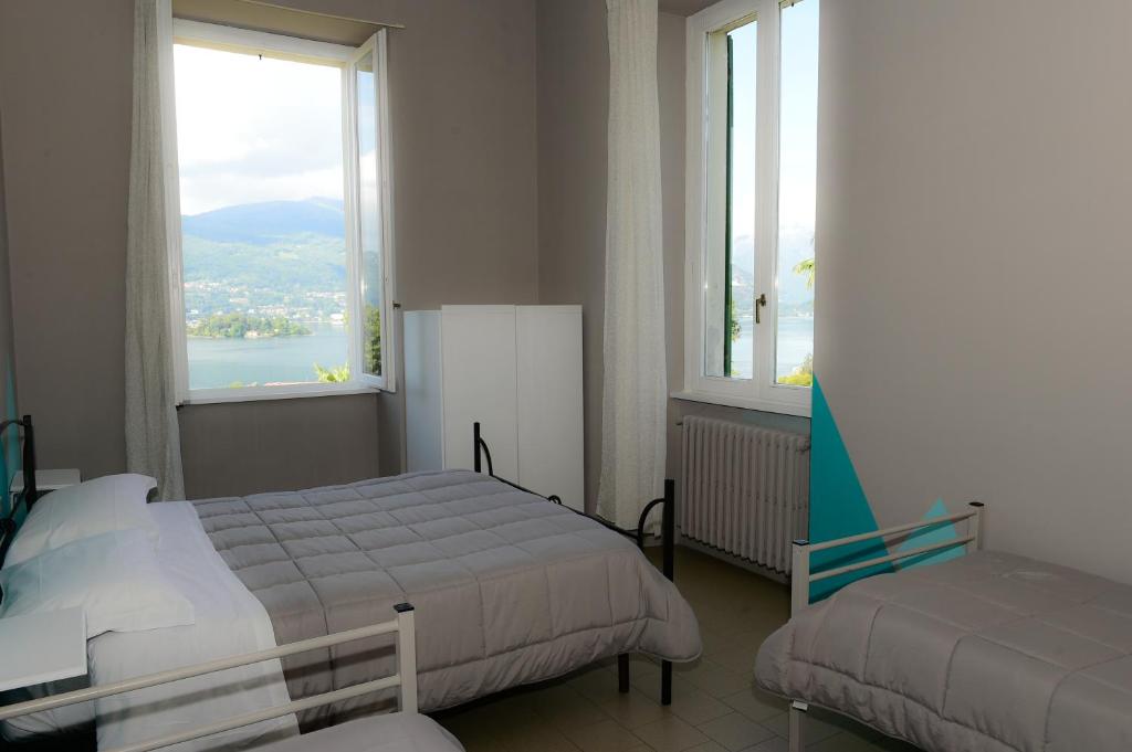 Ostello Verbania - Chambre Quadruple Avec Salle De Bains Commune