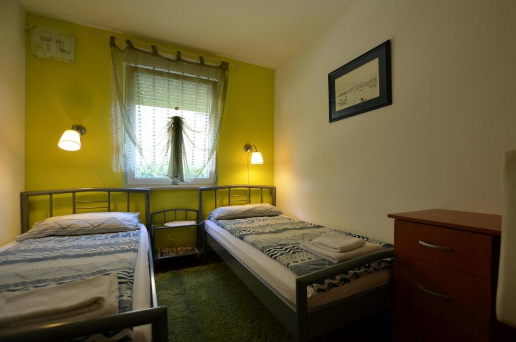Postel nebo postele na pokoji v ubytování Villa Ketty
