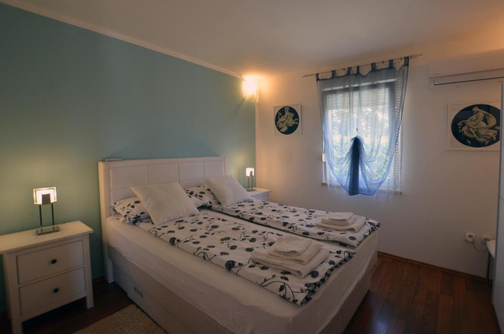Postel nebo postele na pokoji v ubytování Villa Ketty