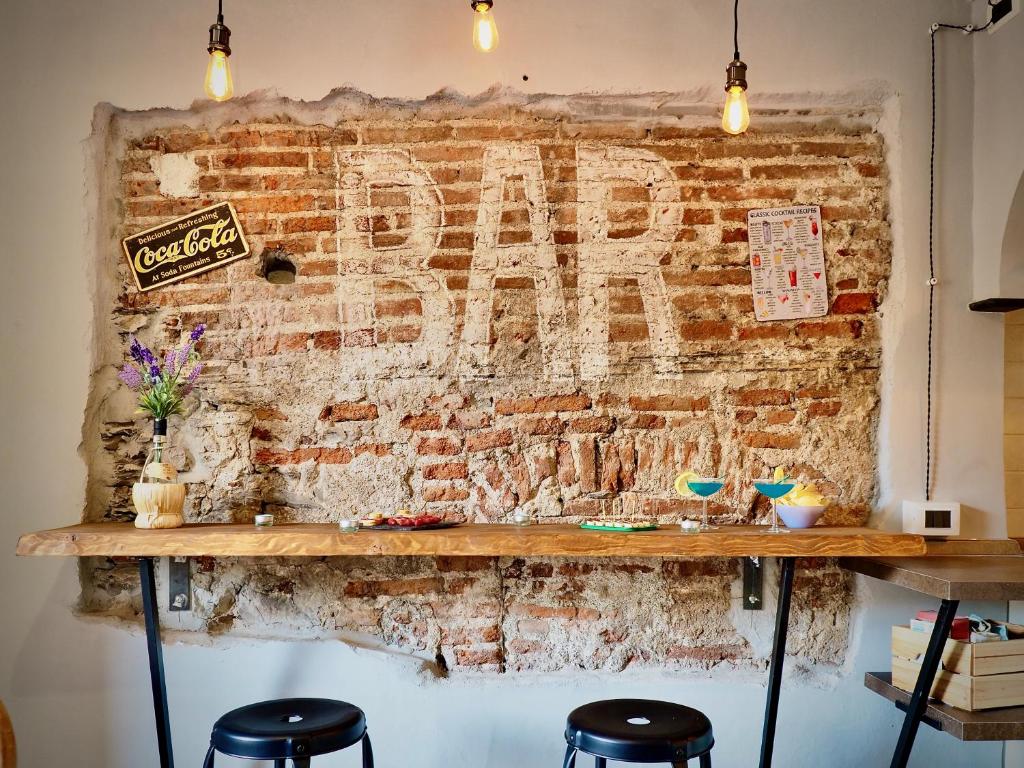 a brick wall with a pepsi sign on it at DIMORA DEL CARMINE ACQUARIO - GENOVABNB it in Genova