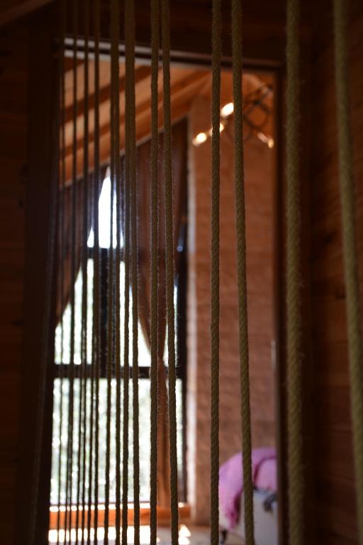 a view of a window with bars on a door at OLEA COTTAGE in Ulcinj