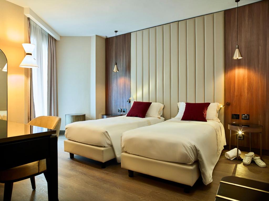 Postel nebo postele na pokoji v ubytování Hotel Niccolo' V - Terme dei Papi