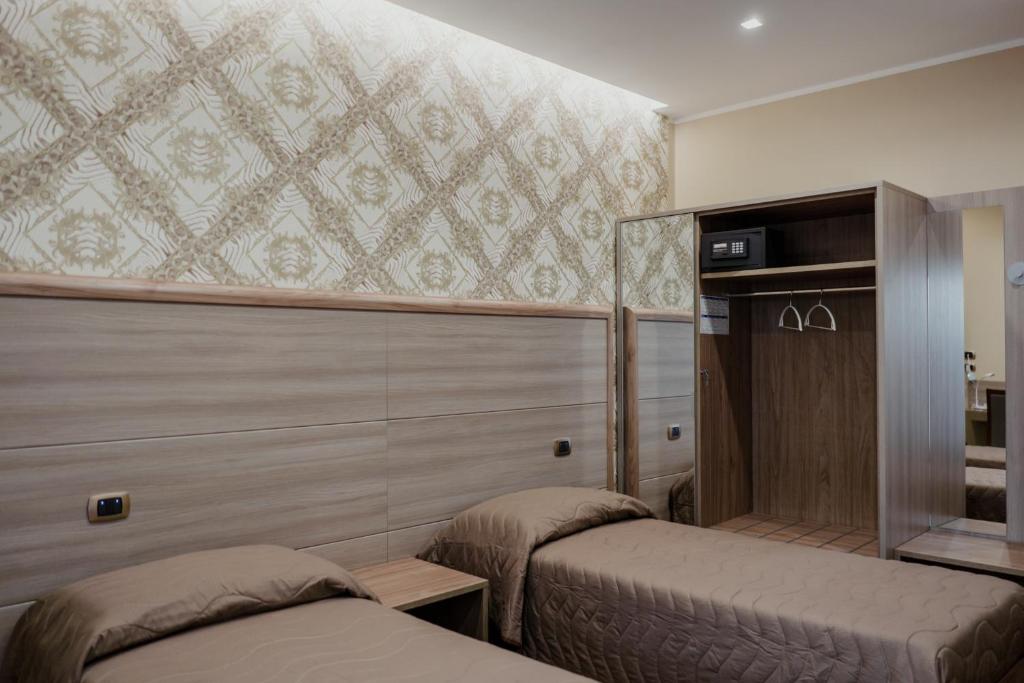 A bed or beds in a room at Miryam House Affittacamere Suite e Relax