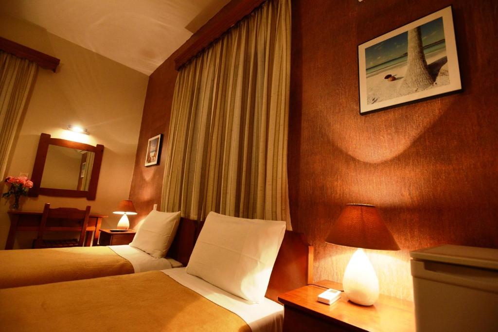 Postel nebo postele na pokoji v ubytování Argo Hotel