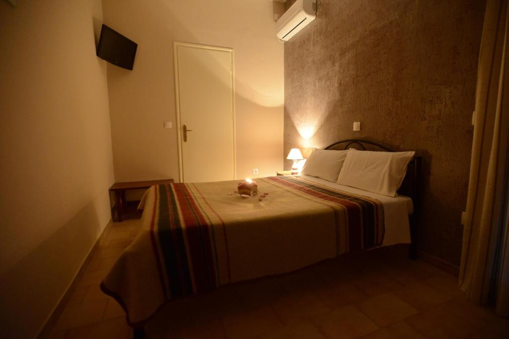 Postel nebo postele na pokoji v ubytování Argo Hotel