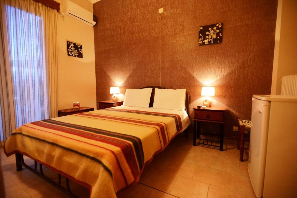 Postel nebo postele na pokoji v ubytování Argo Hotel