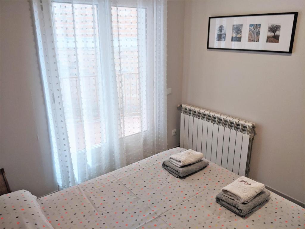 Posteľ alebo postele v izbe v ubytovaní apartament dúplex "Alsina"