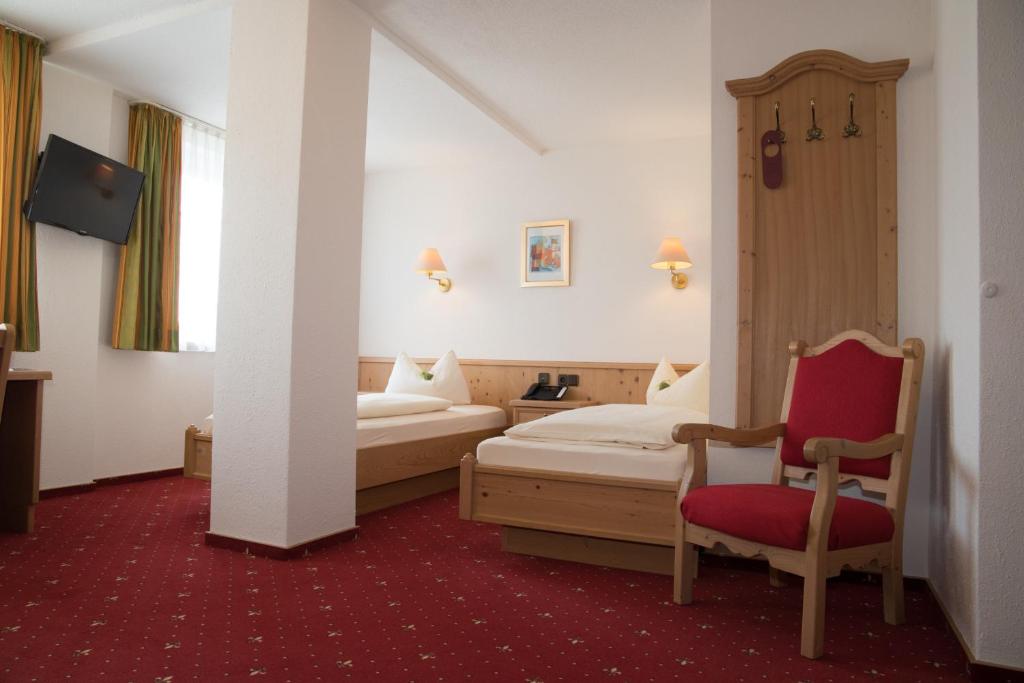 Postel nebo postele na pokoji v ubytování Hotel Bauer garni