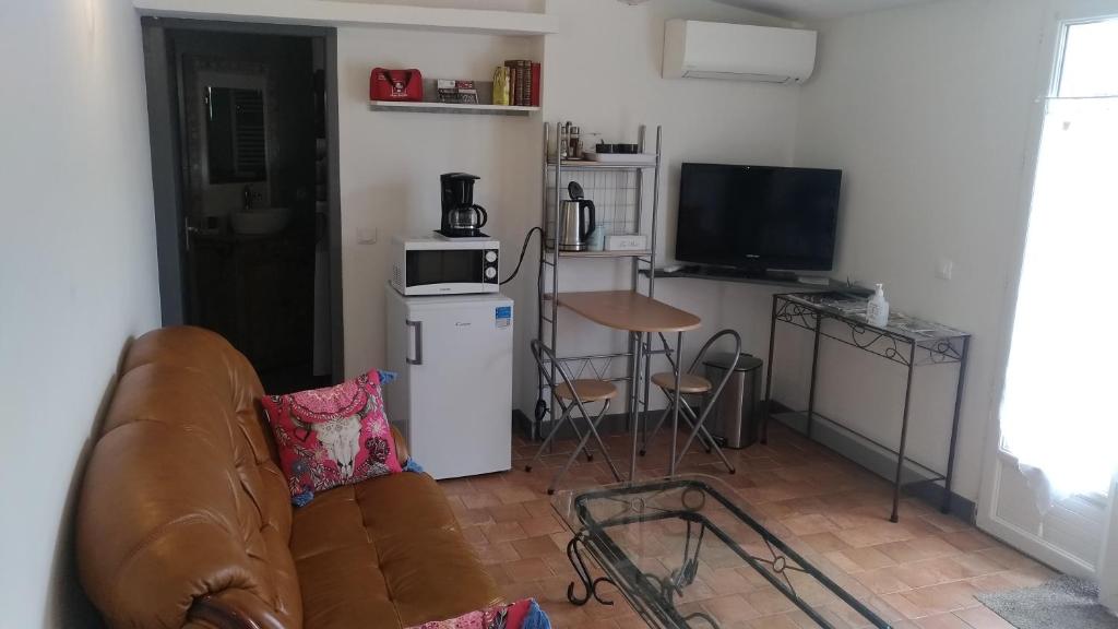 Kuchyň nebo kuchyňský kout v ubytování L'ilot de Carpentras