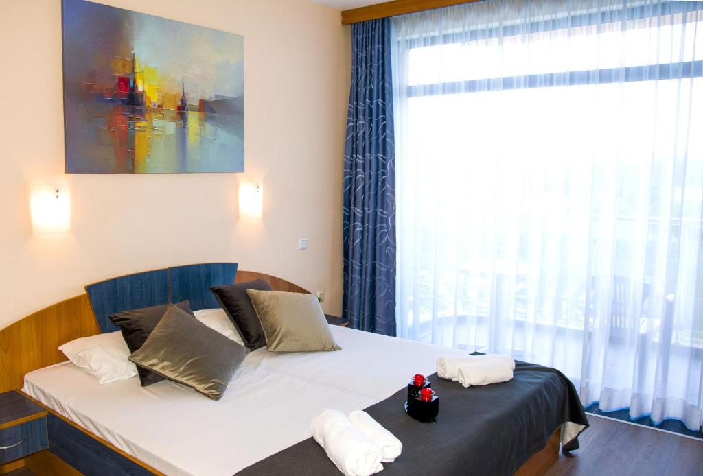 Postel nebo postele na pokoji v ubytování Hotel Penelope