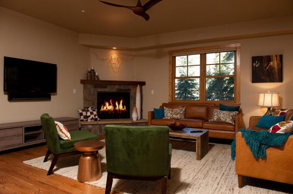 a living room with a couch and a fireplace at Black Bear 86 in Durango Mountain Resort