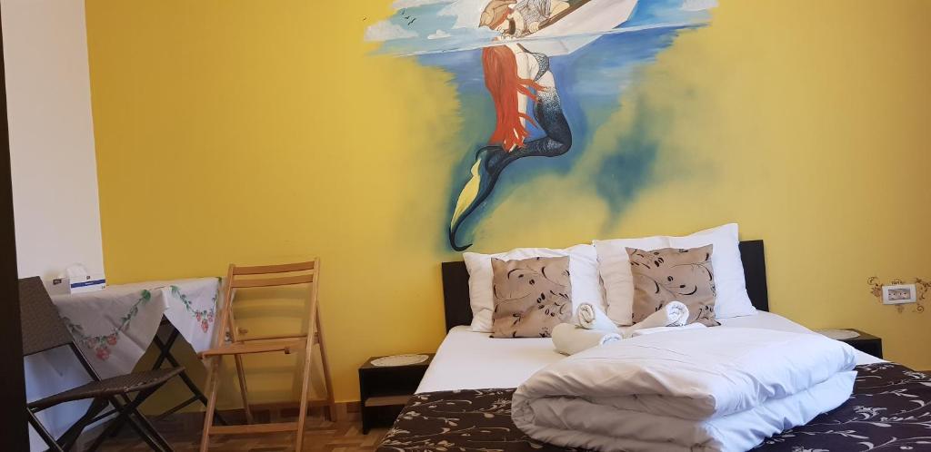 Postel nebo postele na pokoji v ubytování EL Capitano - Mamaia Nord