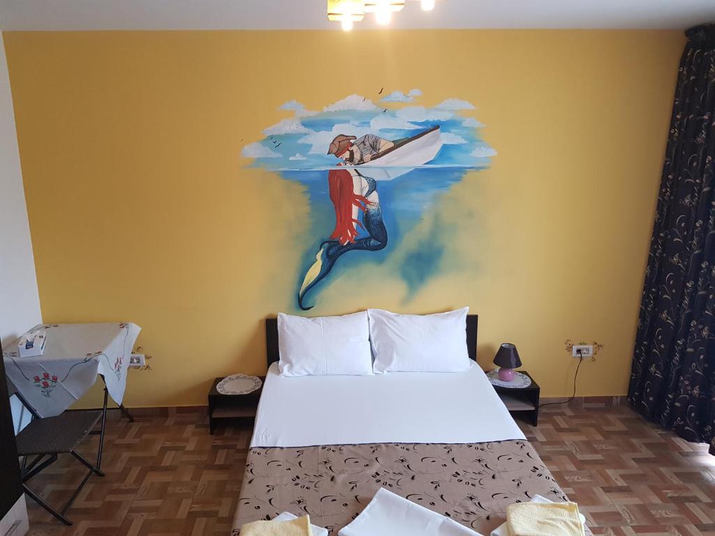 Postel nebo postele na pokoji v ubytování EL Capitano - Mamaia Nord