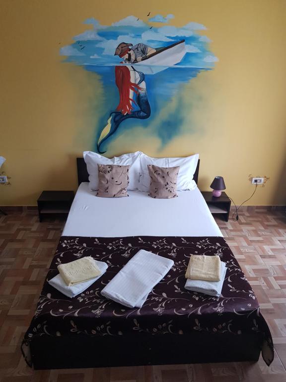 เตียงในห้องที่ EL Capitano - Mamaia Nord