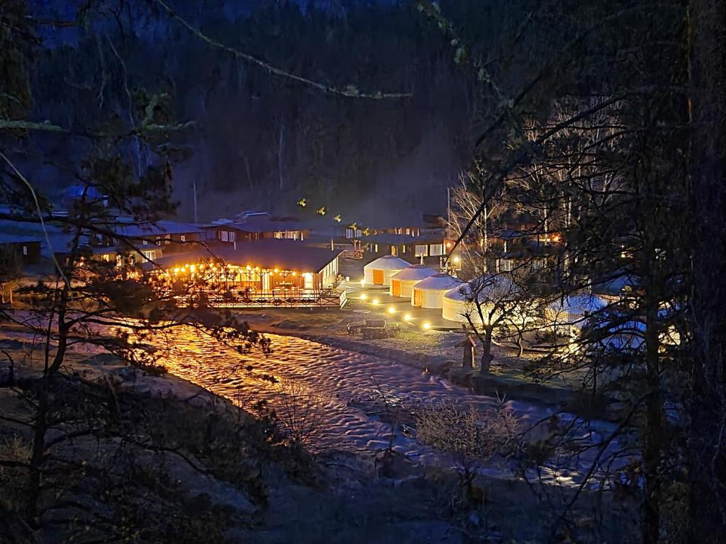 a village in the snow at night at Айбарка in Uznezya