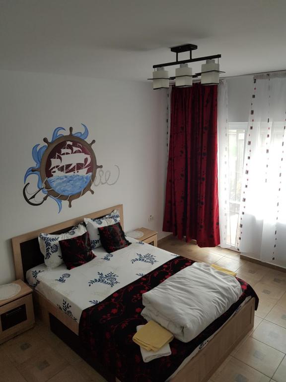Postel nebo postele na pokoji v ubytování EL Capitano - Mamaia Nord