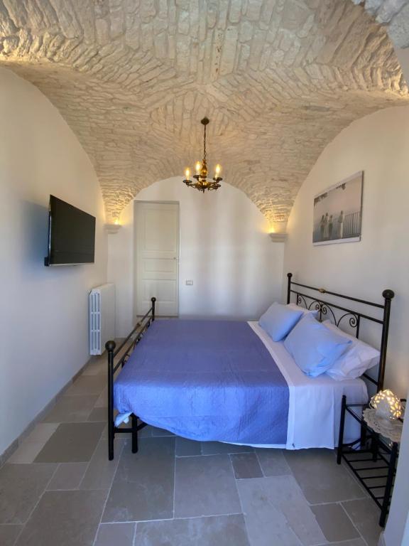 Ένα ή περισσότερα κρεβάτια σε δωμάτιο στο Le Tre Terrazze