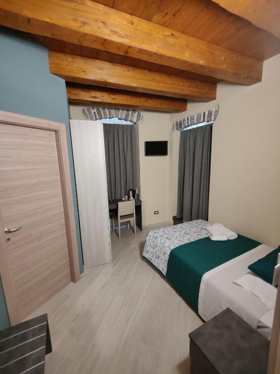 Postel nebo postele na pokoji v ubytování Dimora Del Corso
