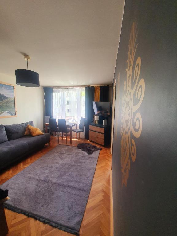 Posedenie v ubytovaní Apartament IZBA W CENTRUM