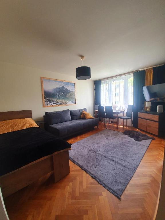 Posedenie v ubytovaní Apartament IZBA W CENTRUM