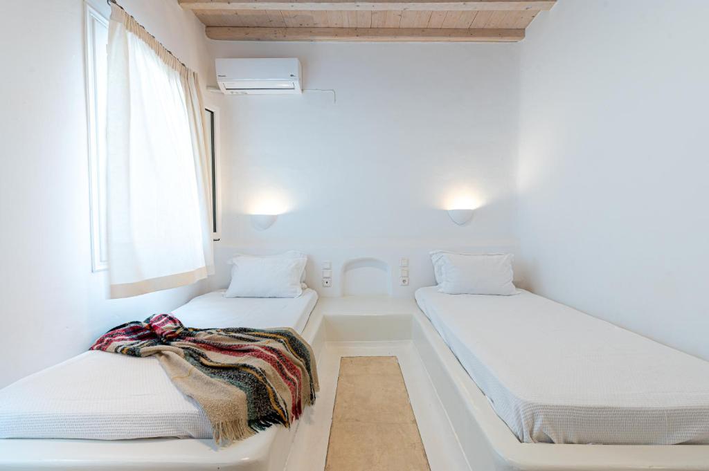 Posteľ alebo postele v izbe v ubytovaní Golden Sunset Villas