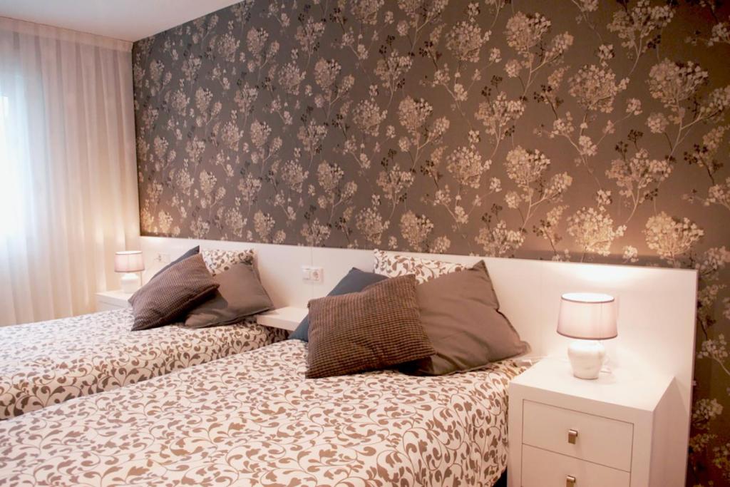 Postel nebo postele na pokoji v ubytování Silver Home