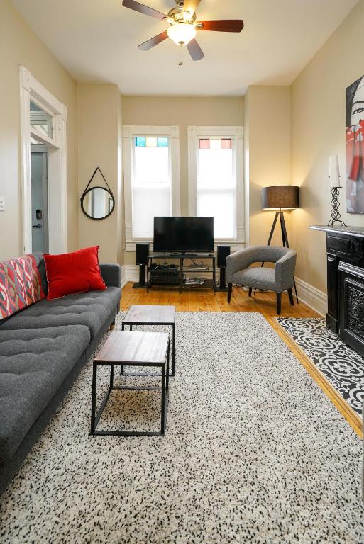 a living room with a couch and a fireplace at 2360 Glenarm Place in Denver