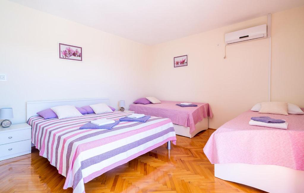 Posteľ alebo postele v izbe v ubytovaní Apartman Ana Marija