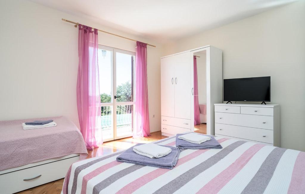 Posteľ alebo postele v izbe v ubytovaní Apartman Ana Marija
