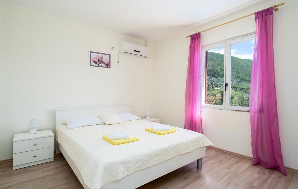 Posteľ alebo postele v izbe v ubytovaní Apartman Ana Marija