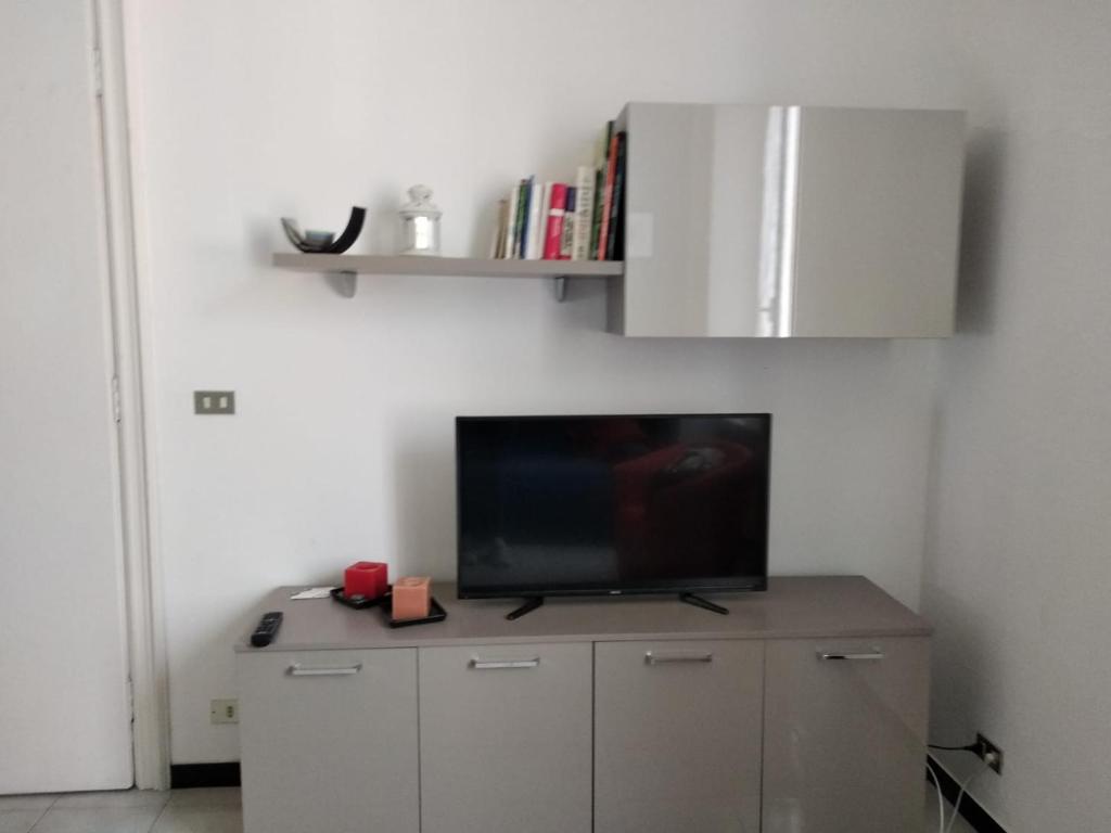 Televízia a/alebo spoločenská miestnosť v ubytovaní Casa Lucia