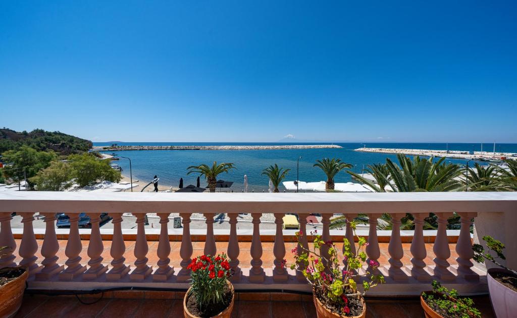a balcony with a view of the ocean at sidestory in Limenaria