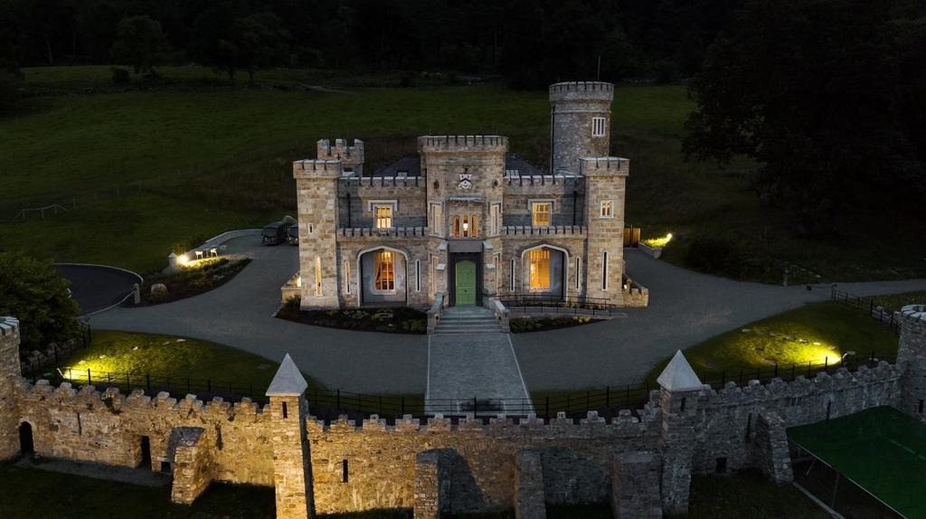 an old castle at night with lights on it at Clanrye House Guest Accommodation in Newry