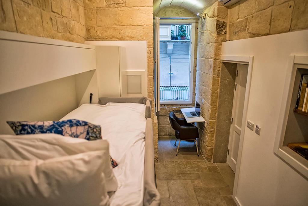 Postel nebo postele na pokoji v ubytování No 68 in Valletta