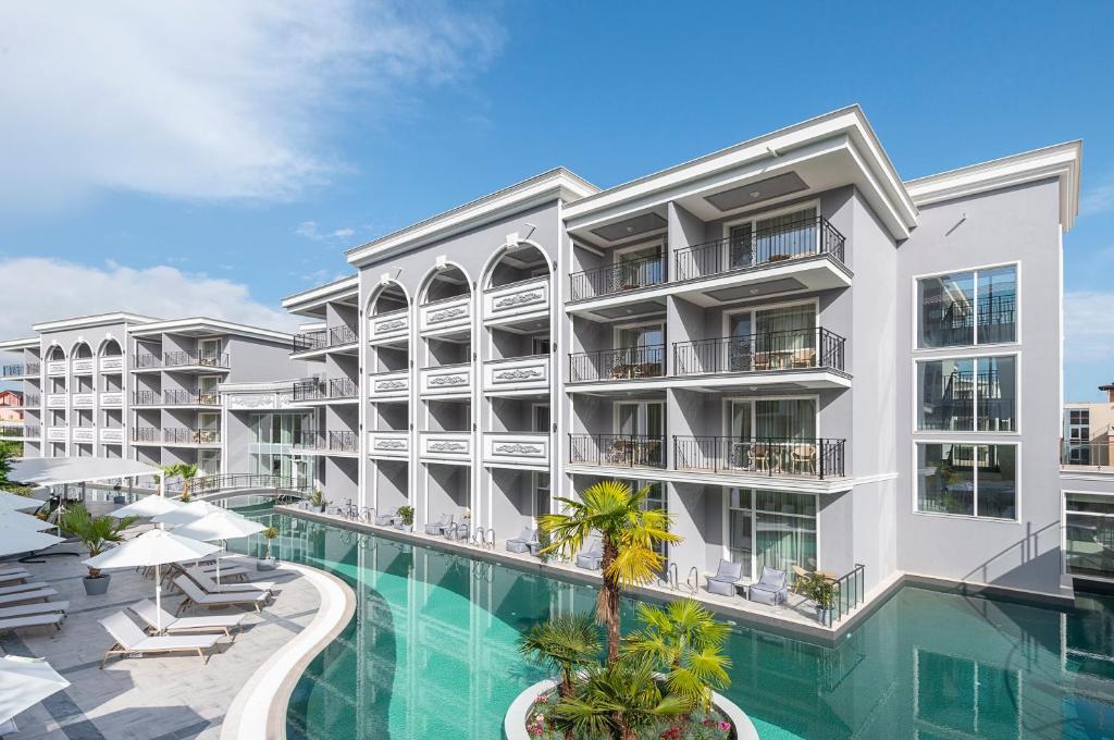 an image of an apartment building with a swimming pool at Siena Premium Retreat in Lozenets