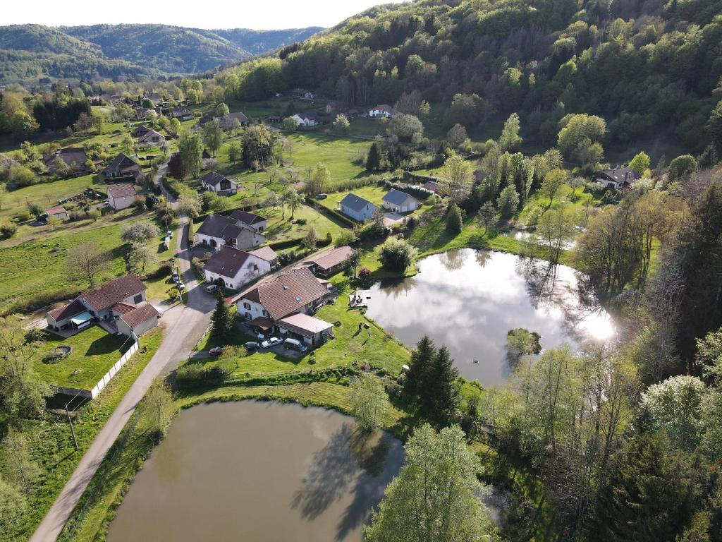 an aerial view of a village with two ponds at GITE LES ECUREUILS in Fresse