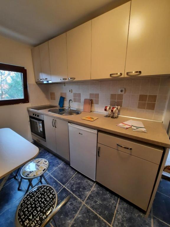a kitchen with a sink and a counter top at Villa M in Vinci